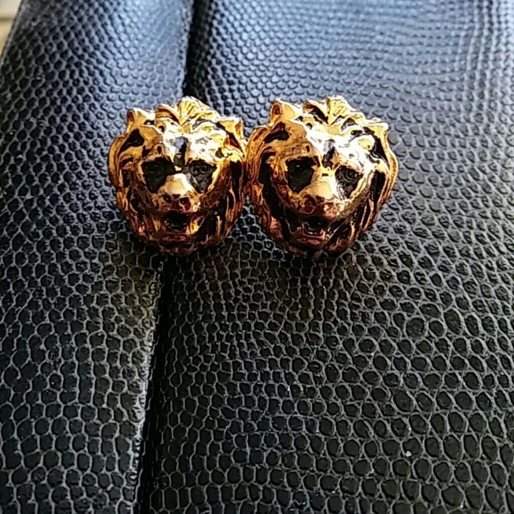 Pair of gold tone earrings